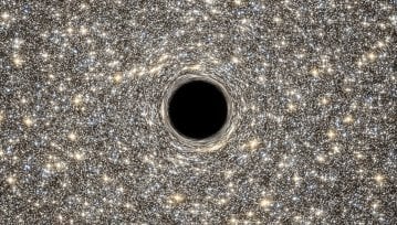 Teleskop Hubble'a pomaga odkryć jedną z najmniejszych galaktyk zawierającą jednocześnie ogromną czarną dziurę